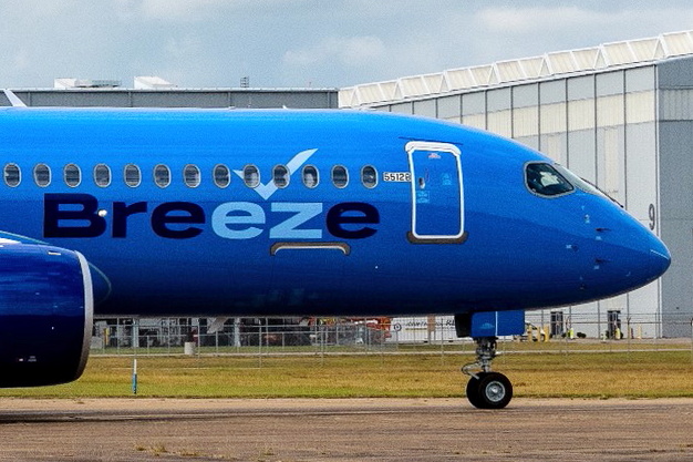 Breeze Airways used a preview event at the Airbus A220 final assembly line in Mobile, Alabama to unveil its latest aircraft. The A220-300, the first of 80 on order, is expected to be delivered to Breeze in the coming weeks. Breezes A220-300 cabin is configured in a two-class 126-seat cabin layout comprising 36 business and 90 economy seats fitted with in-seat power and USB ports for all passengers. Click to enlarge.